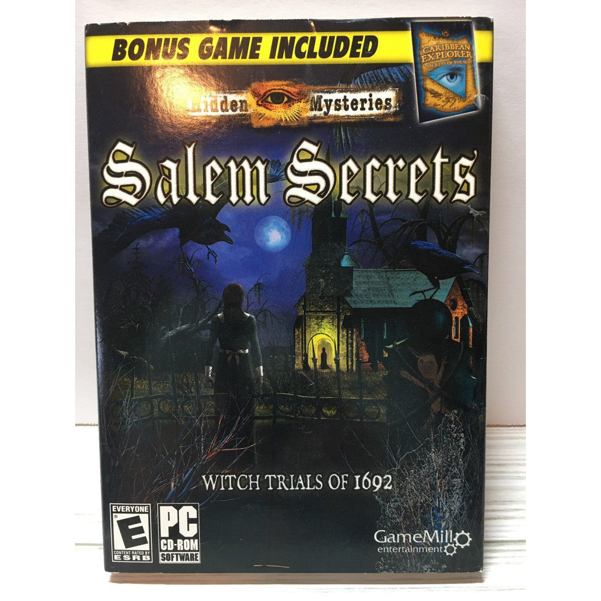 Game box for 'Salem Secrets: Witch Trials of 1692' with dark, eerie design and text about bonus game included.
