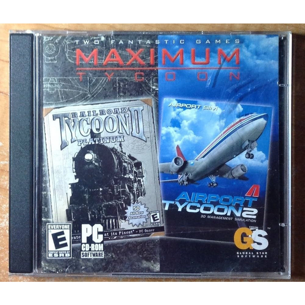 Two computer game boxes for 'Railroad Tycoon II Platinum' and 'Airport Tycoon 2' on a wooden surface.