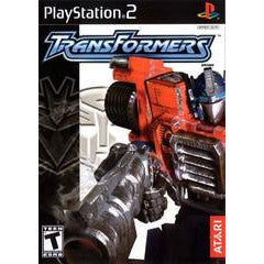 PlayStation 2 game cover for 'Transformers' featuring two robots in a battle pose.