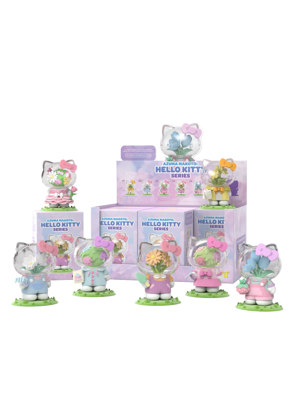 Collection of Hello Kitty figurines with pastel colors and packaging on a white background