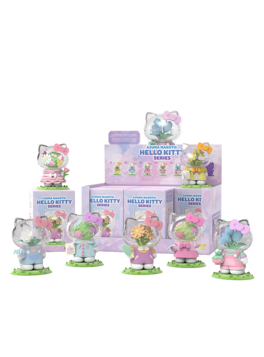 Collection of Hello Kitty figurines with pastel colors and packaging on a white background