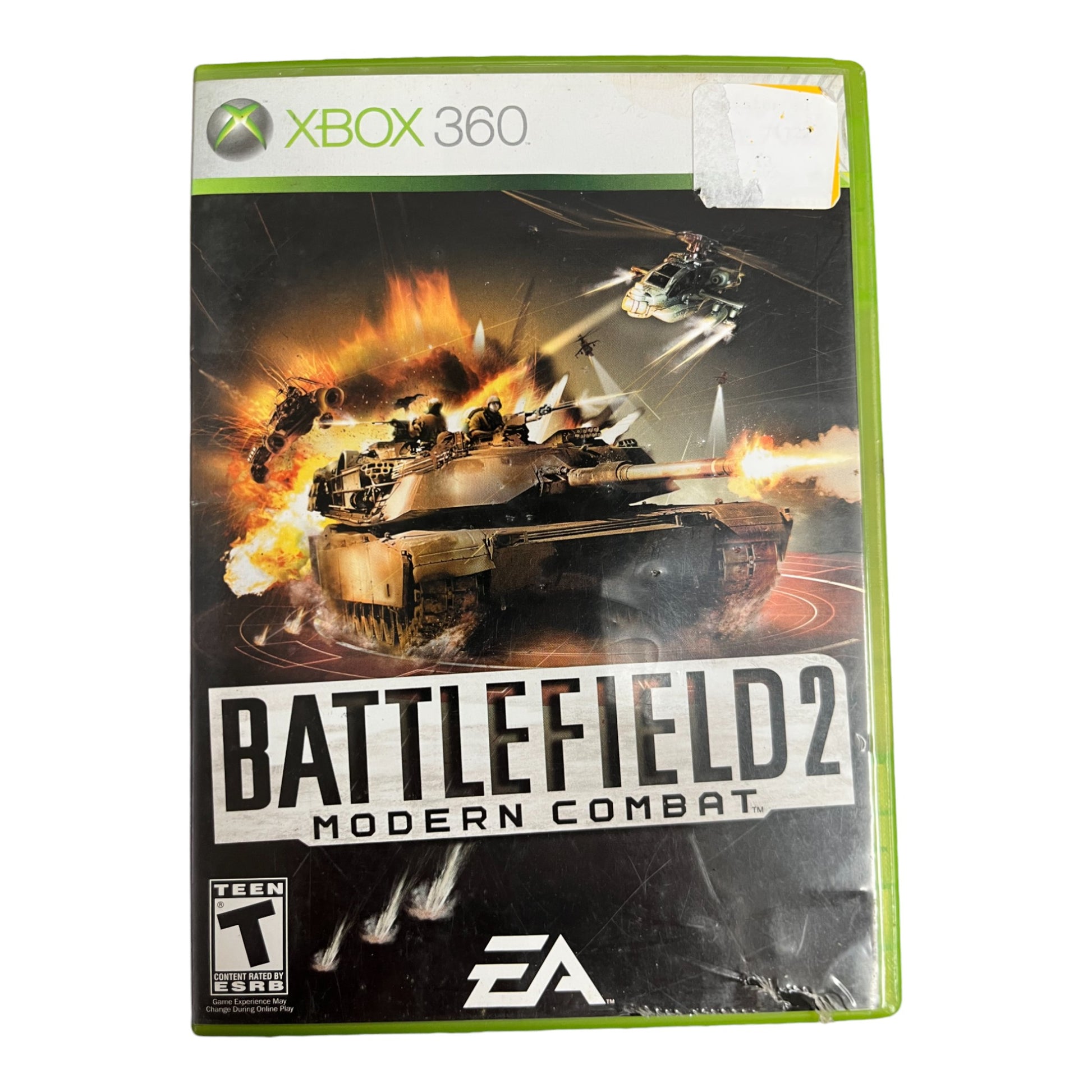 Xbox 360 game case for 'Battlefield 2: Modern Combat' with tank and helicopter graphics.