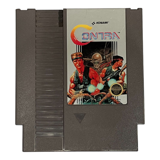 Nintendo Entertainment System game cartridge with 'Contra' packaging featuring characters and Konami logo.