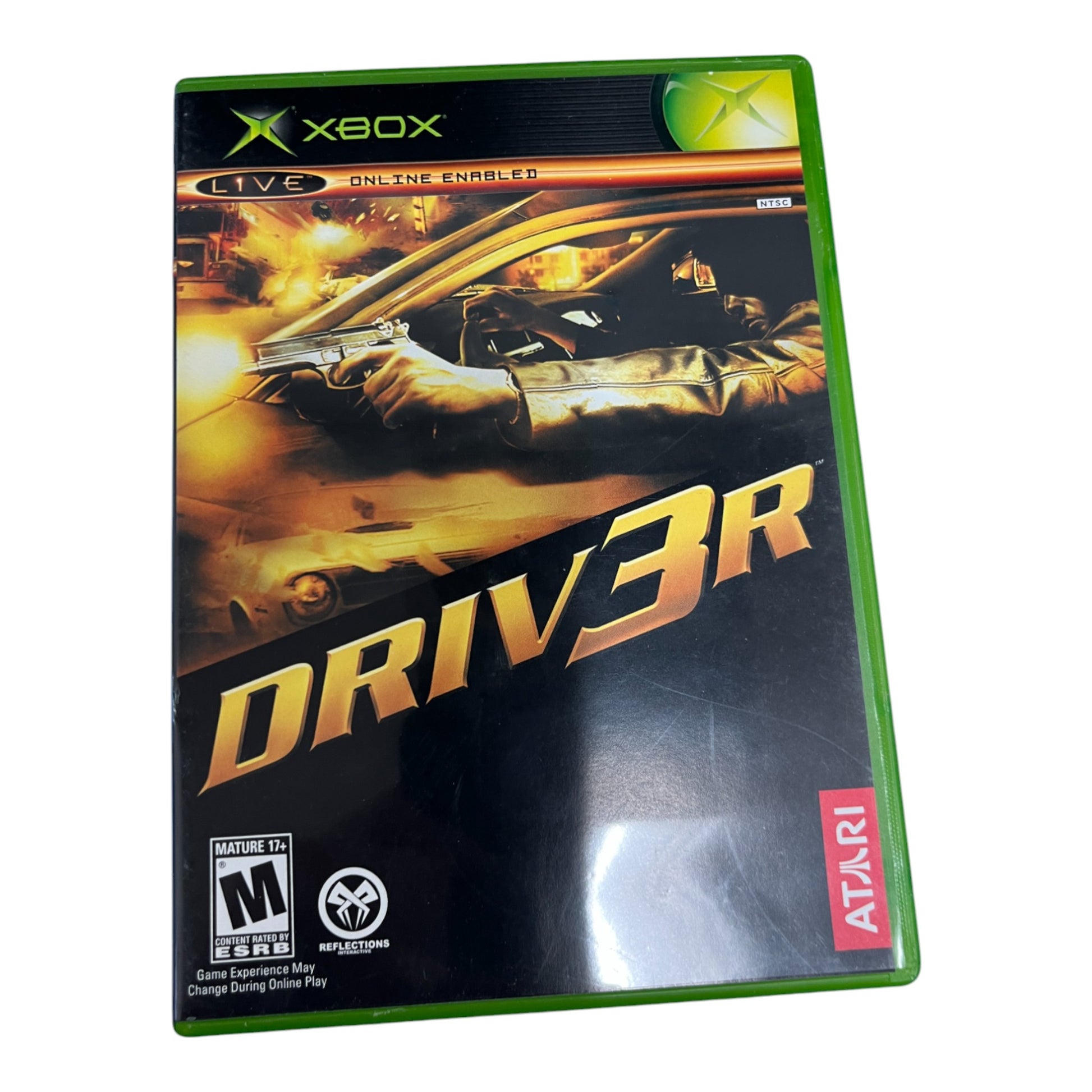 Xbox game case for 'Driver' with a glove holding a gun and car on the cover.
