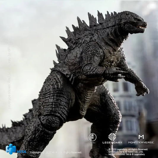  Godzilla action figure with a blurred cityscape background