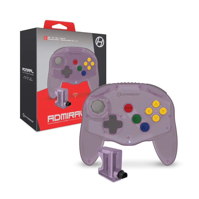 Purple gaming controller with colorful buttons next to its packaging on a white background