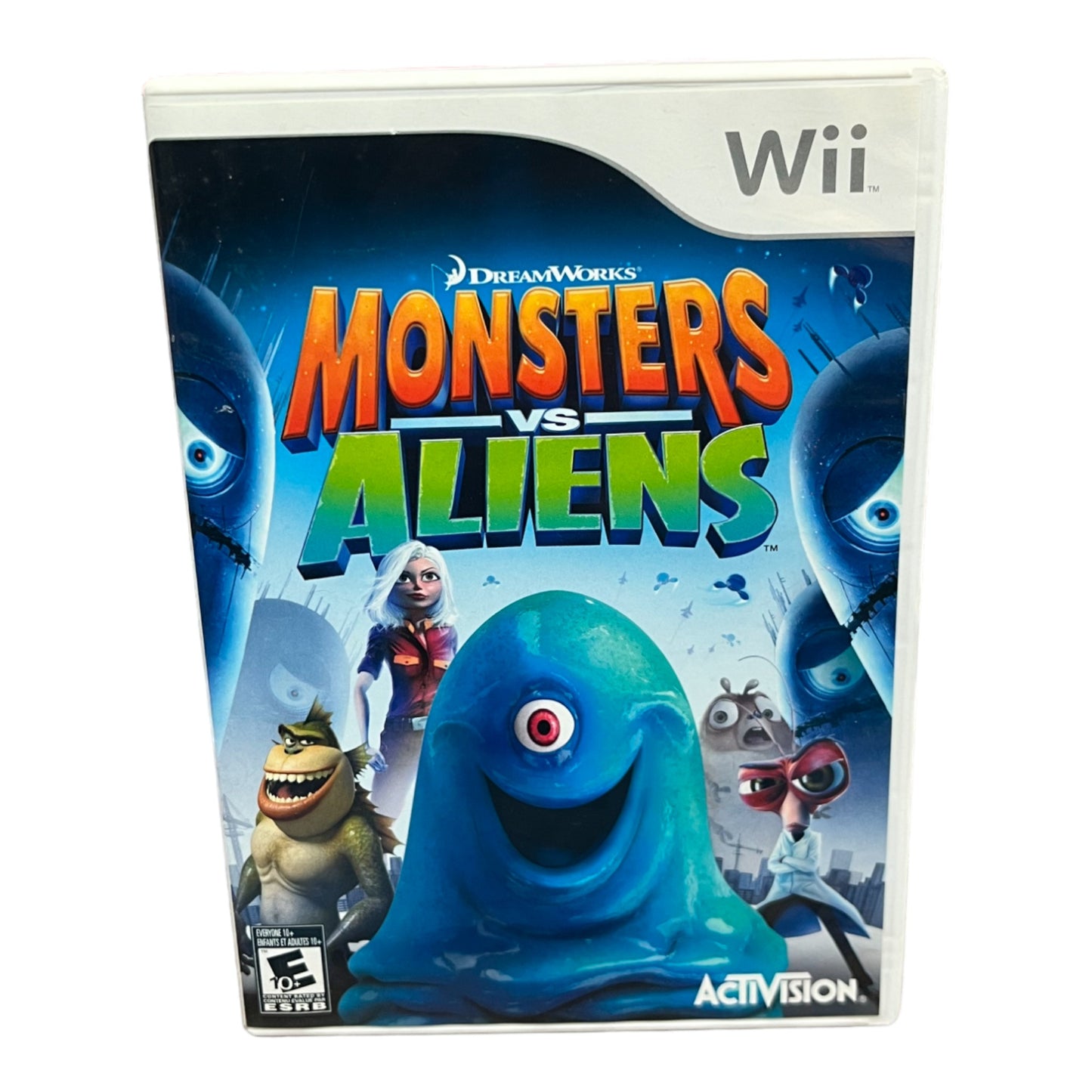 Wii game console cover for 'Monsters vs Aliens' with colorful text and character images.