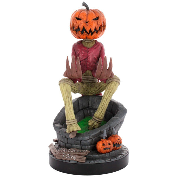 Halloween-themed figurine with a pumpkin head and red shirt on a white background