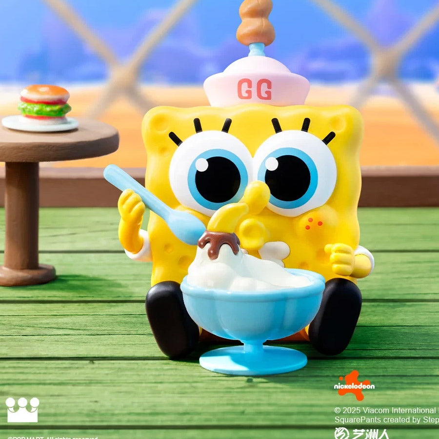 SpongeBob SquarePants toy eating ice cream on a wooden deck with a blurred background