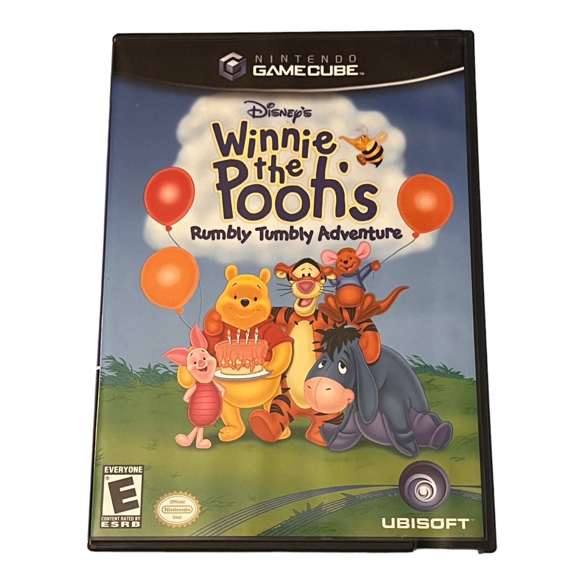 GameCube game case for 'Winnie the Pooh's Rumbly Tumble Adventure' with cartoon characters on a blue background.