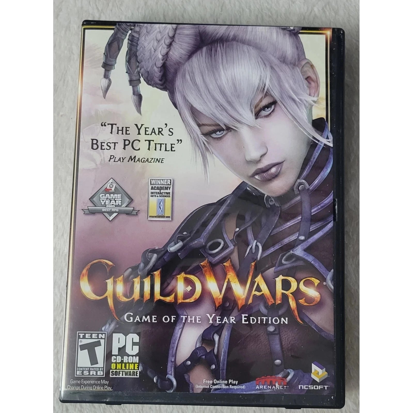 Game case for 'Guild Wars' Game of the Year Edition on a plain background