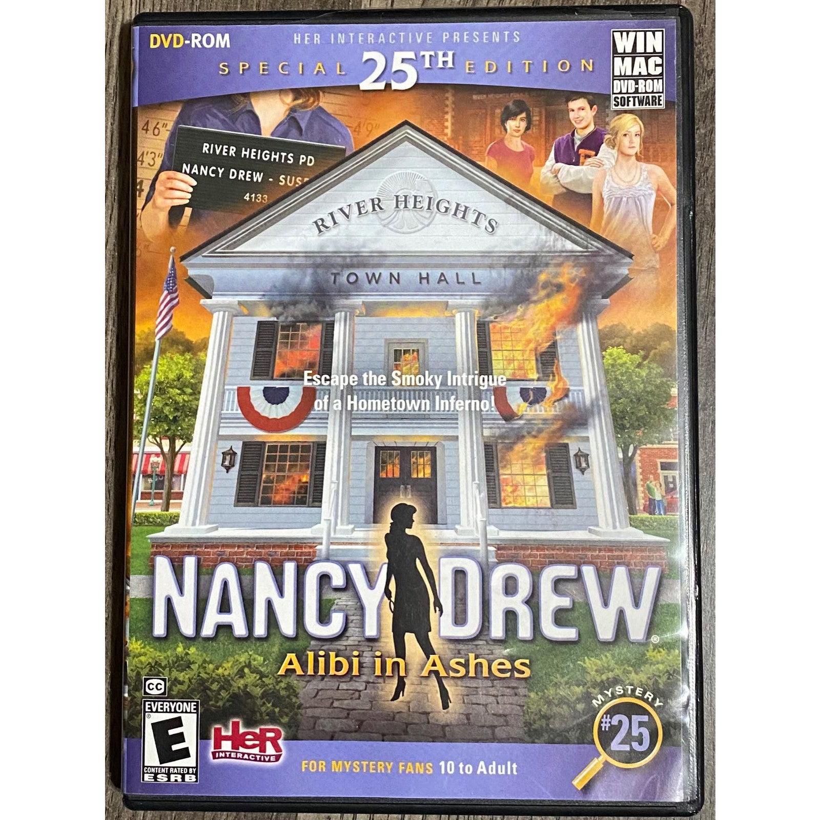 Nancy Drew game cover for 'Alibi in Ashes' with town hall and characters on a DVD-ROM case.