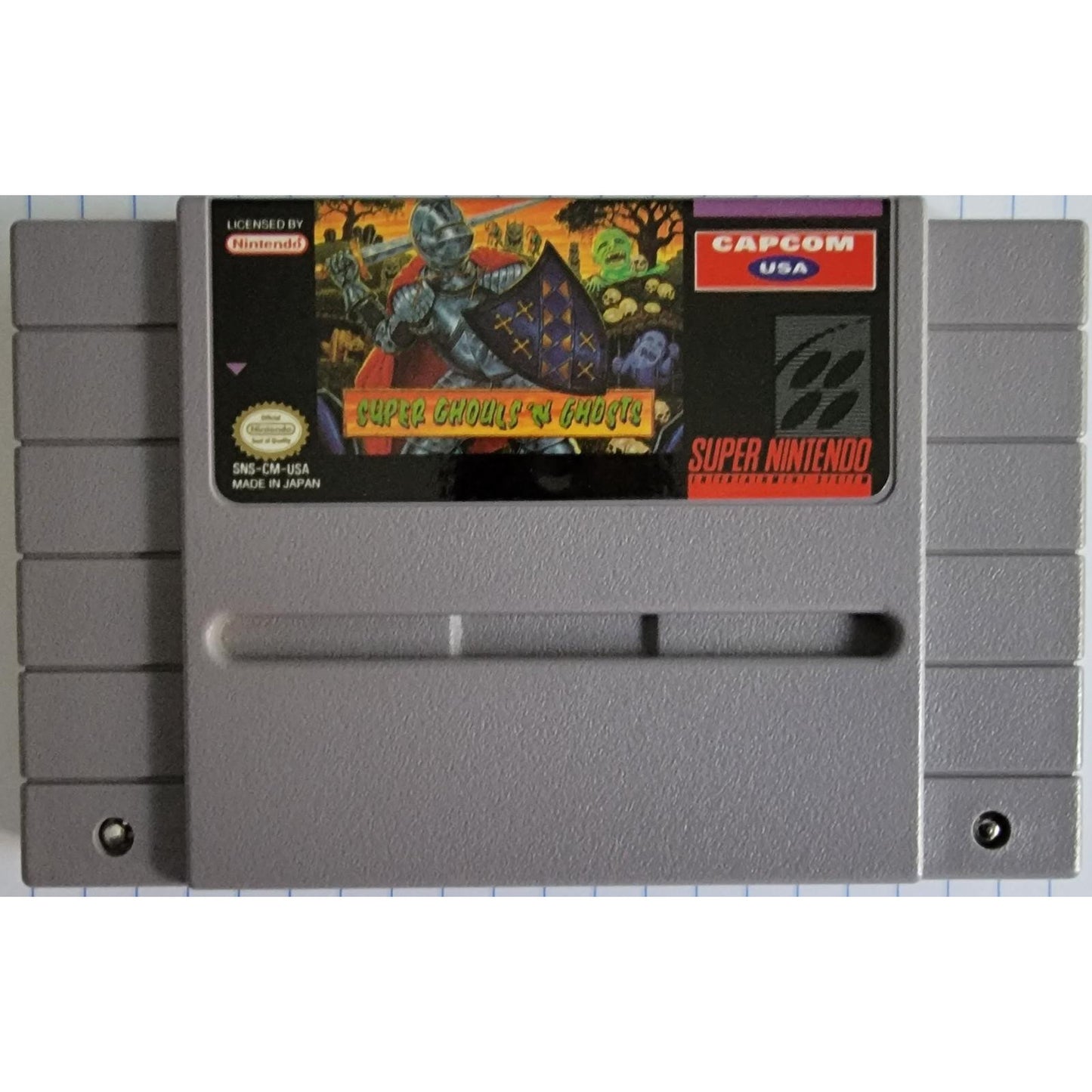 Super Nintendo Entertainment System game cartridge with 'Super Cthulhu vs. Ghosts' cover