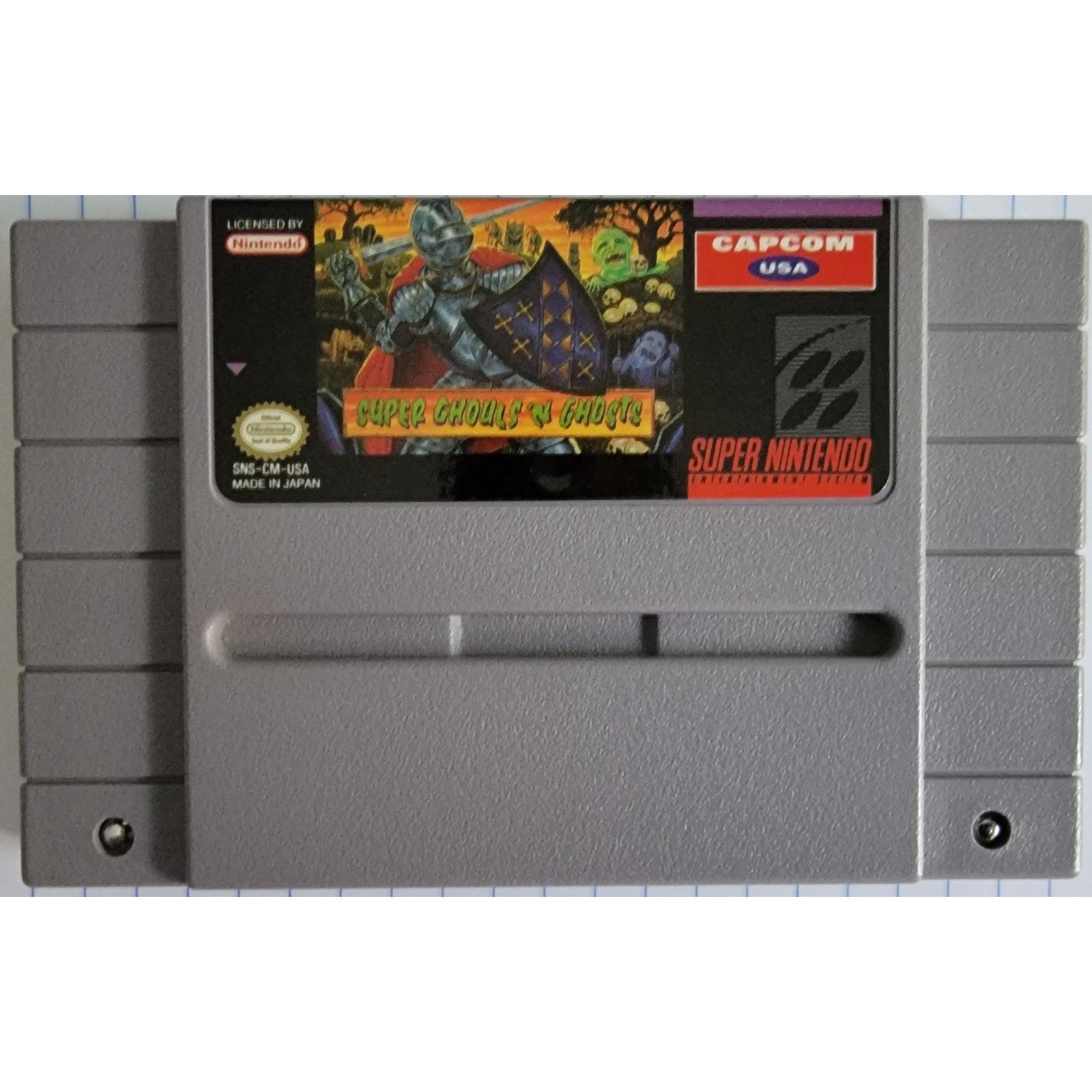 Super Nintendo Entertainment System game cartridge with 'Super Cthulhu vs. Ghosts' cover